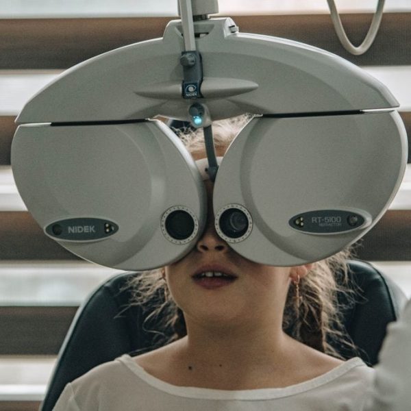 A young girl getting an eye test