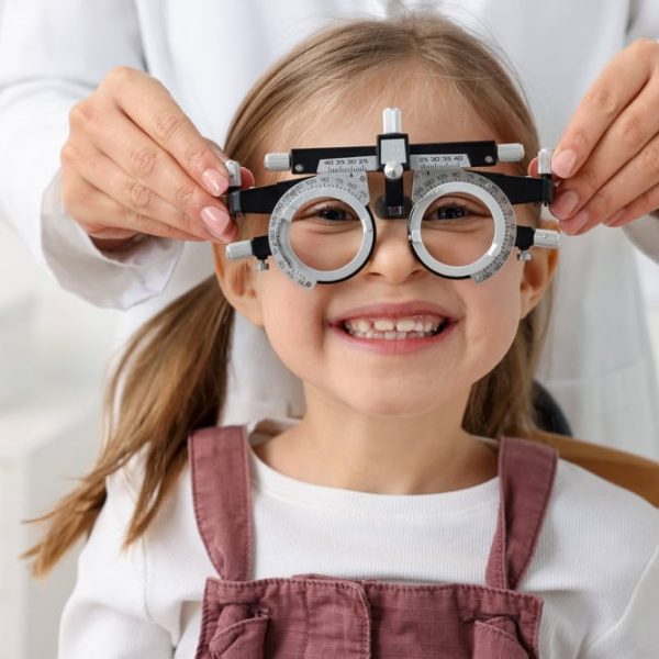 Ophthalmologist,Examining,Patient's,Vision,With,Trial,Frame,In,Clinic,,Closeup